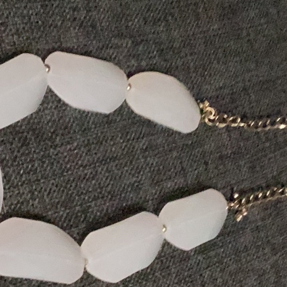 Glowing white necklace blue under up light